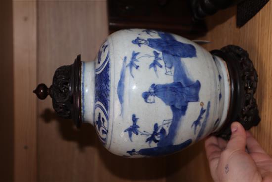 A Chinese Ming blue and white jar, Wanli period, hare mark, with hardwood stand and cover height excl. stand and cover 17cm